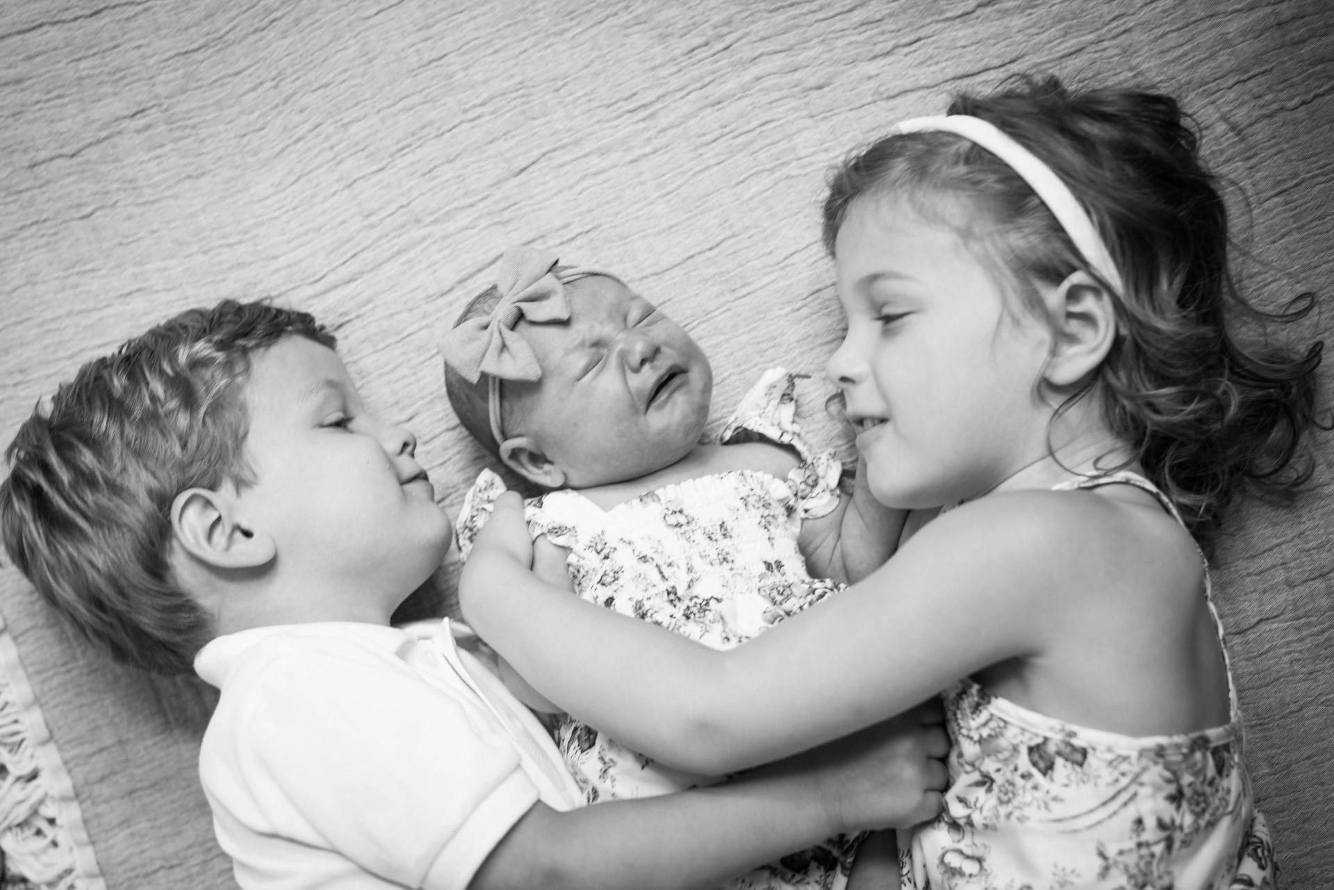 Elly Krueger, who was presenting with infantile spasms, focal seizures, and developmental delays, surrounded by her siblings.