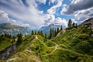 Photo of mountains in front of a blue sky.