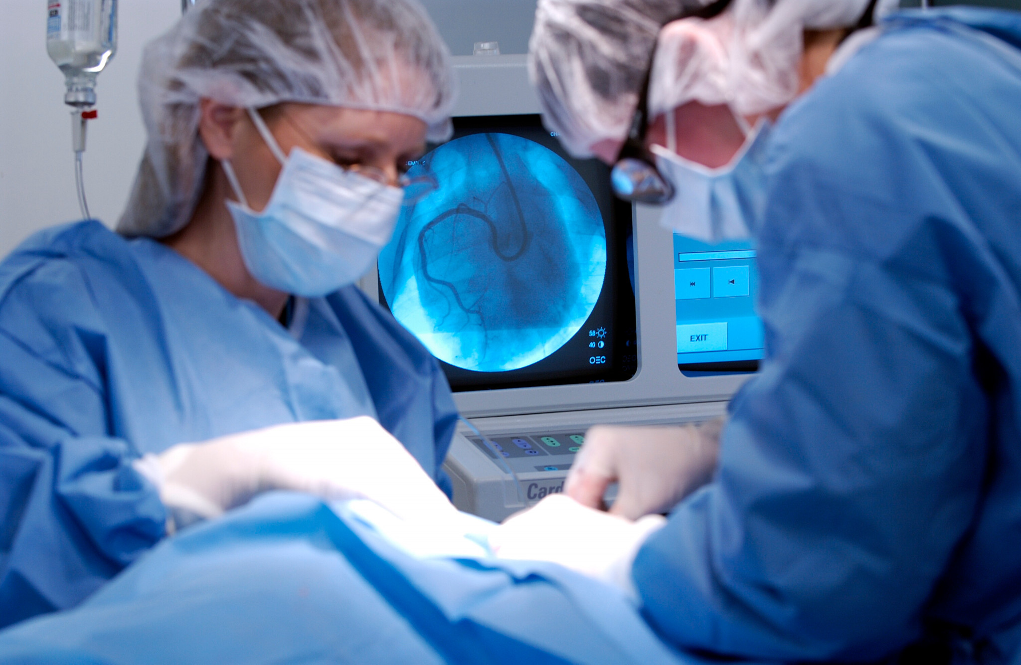 surgeon implanting telemetry device in a rodent