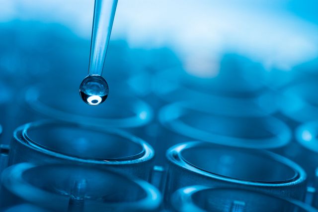 liquid coming out of a dropper representing biotesting