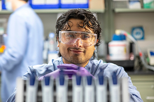photo of lab tech in protective gear