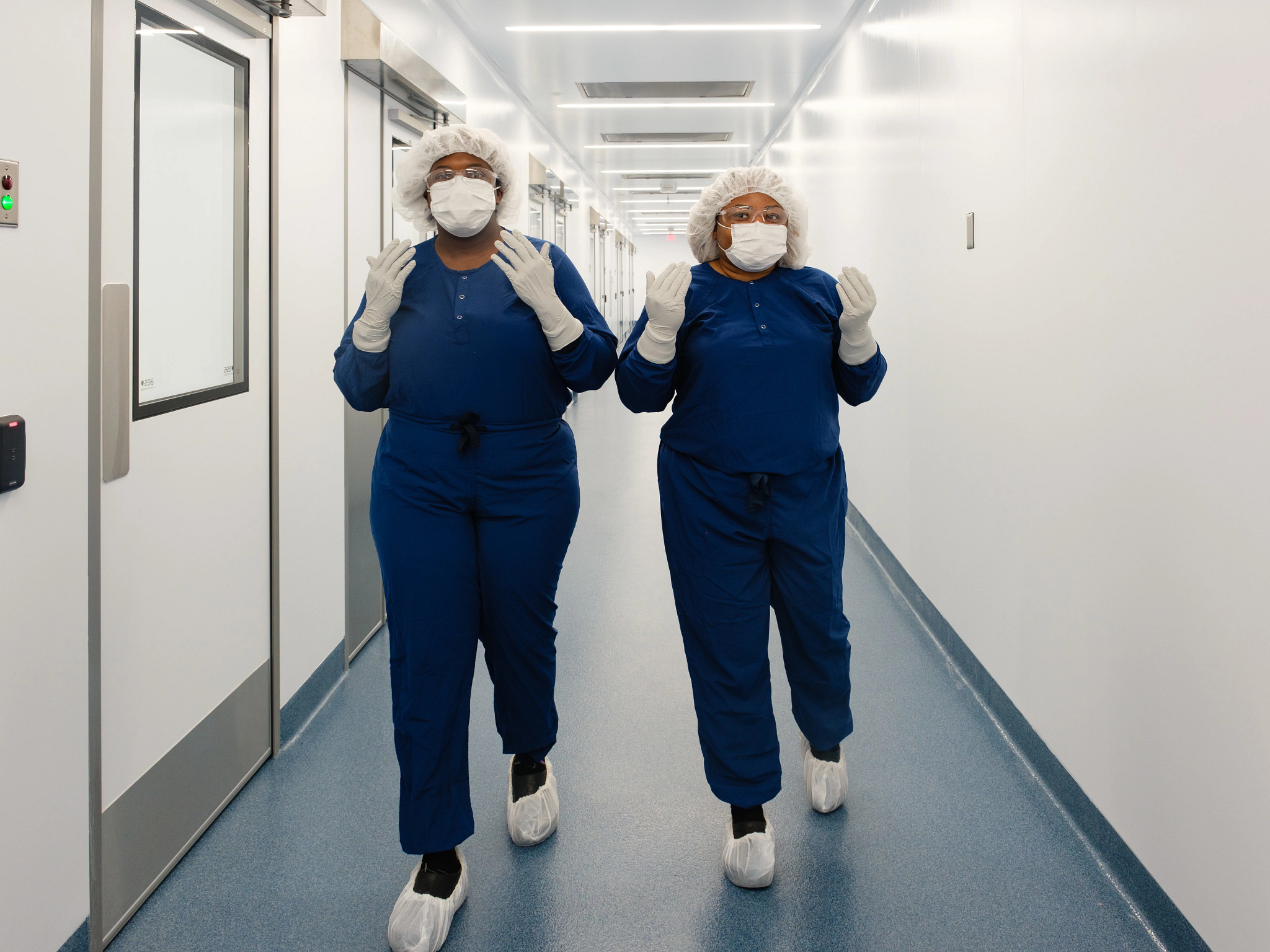 Charles River employees walking down the hallway at the recently improved Memphis CDMO Center of Excellence