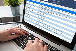 A laptop displaying a list of data