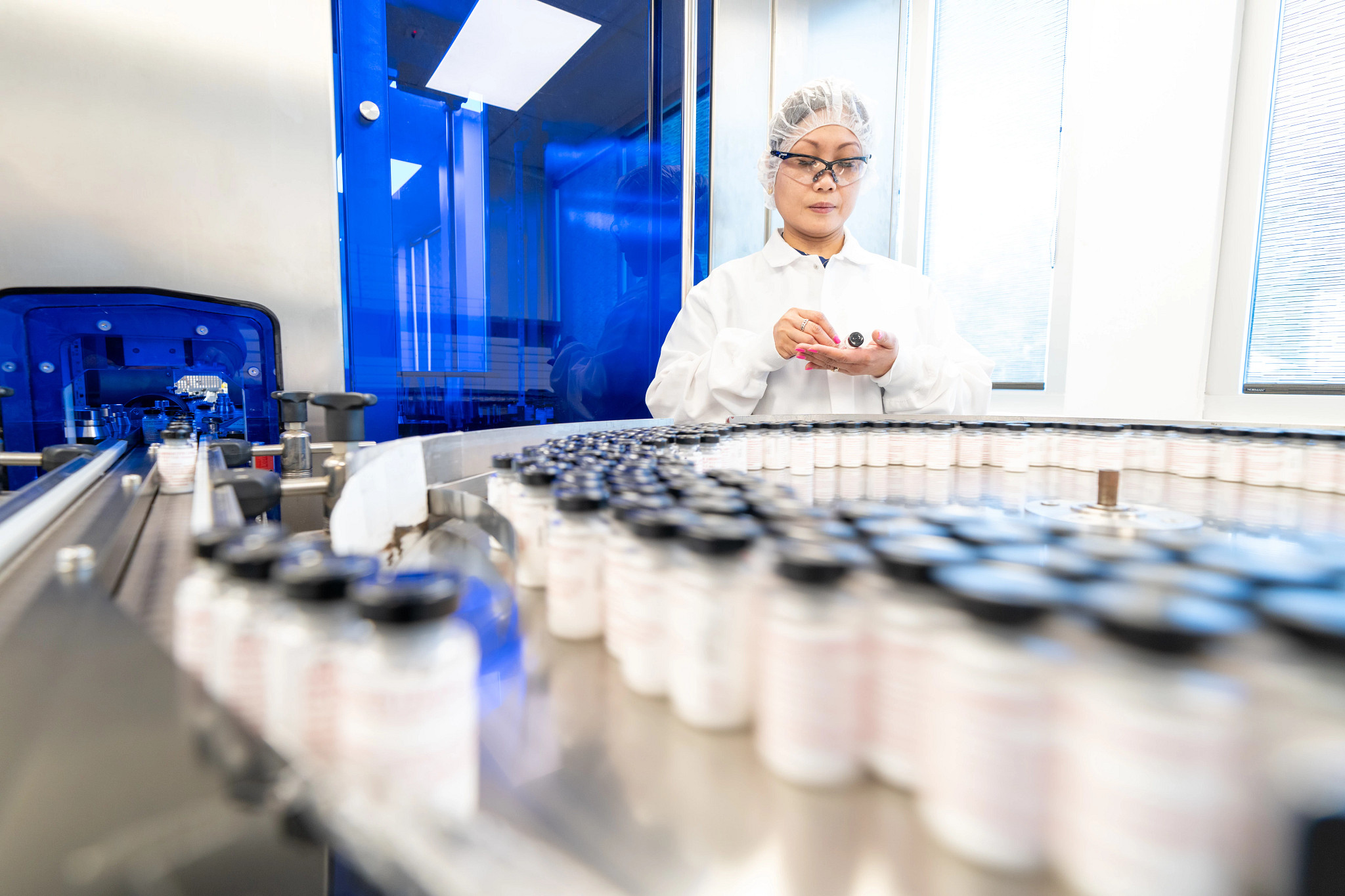 scientist inspecting LAL Vials for compliance
