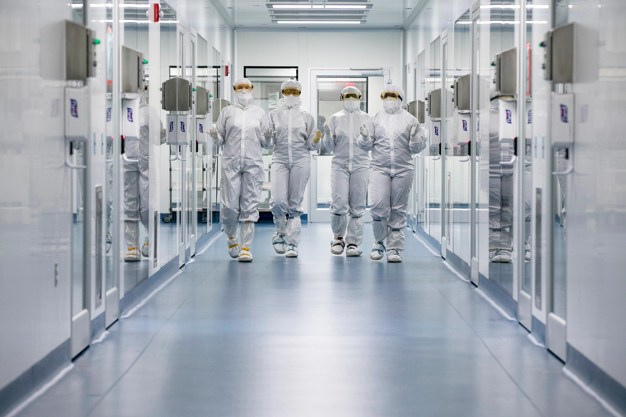 Scientists walking down the hall at the Memphis facility.