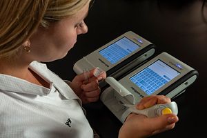 Technician performing assay for host cell proteins (HCPs) in a lab.