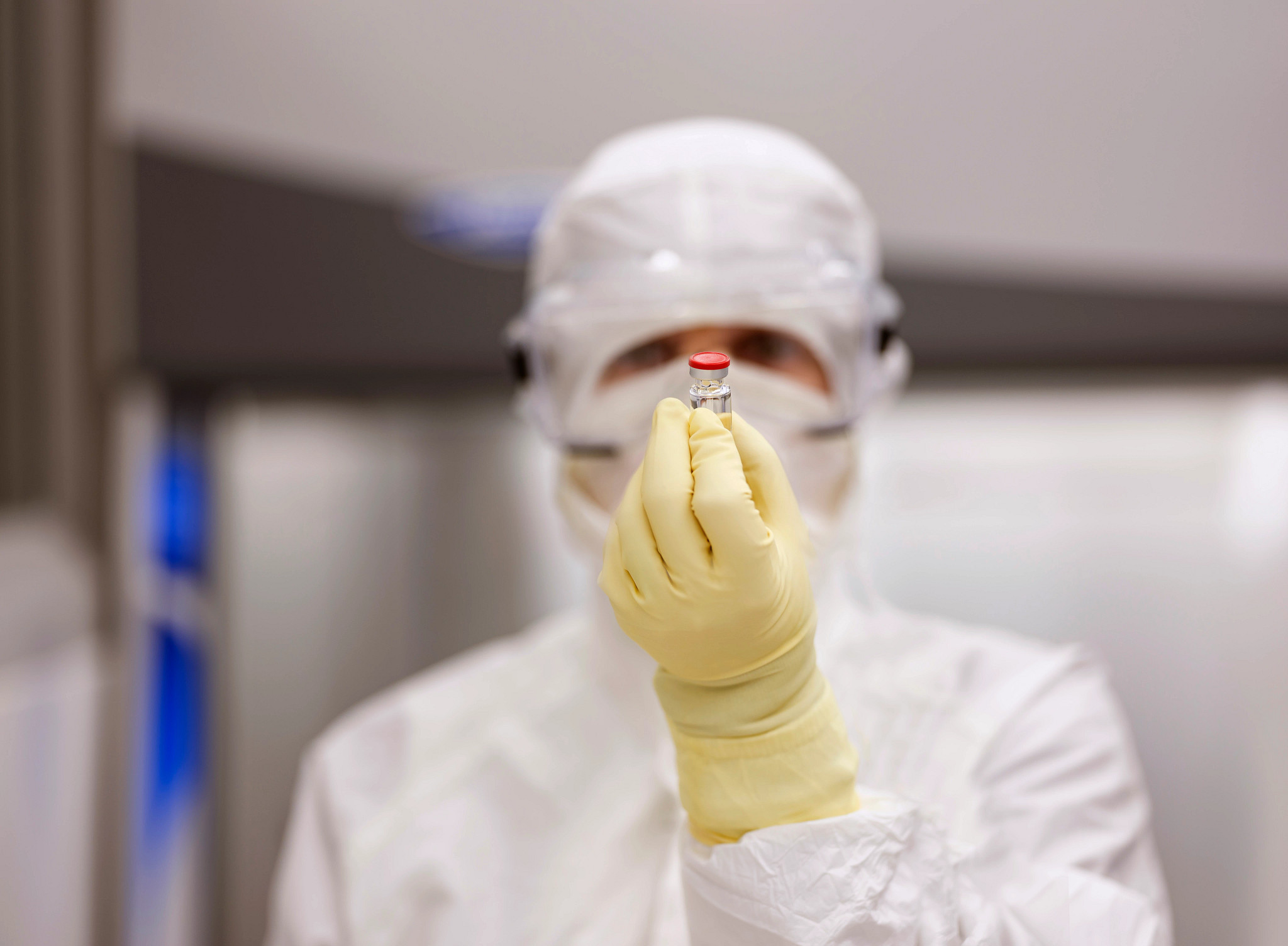 Charles River lab technician holding a vial