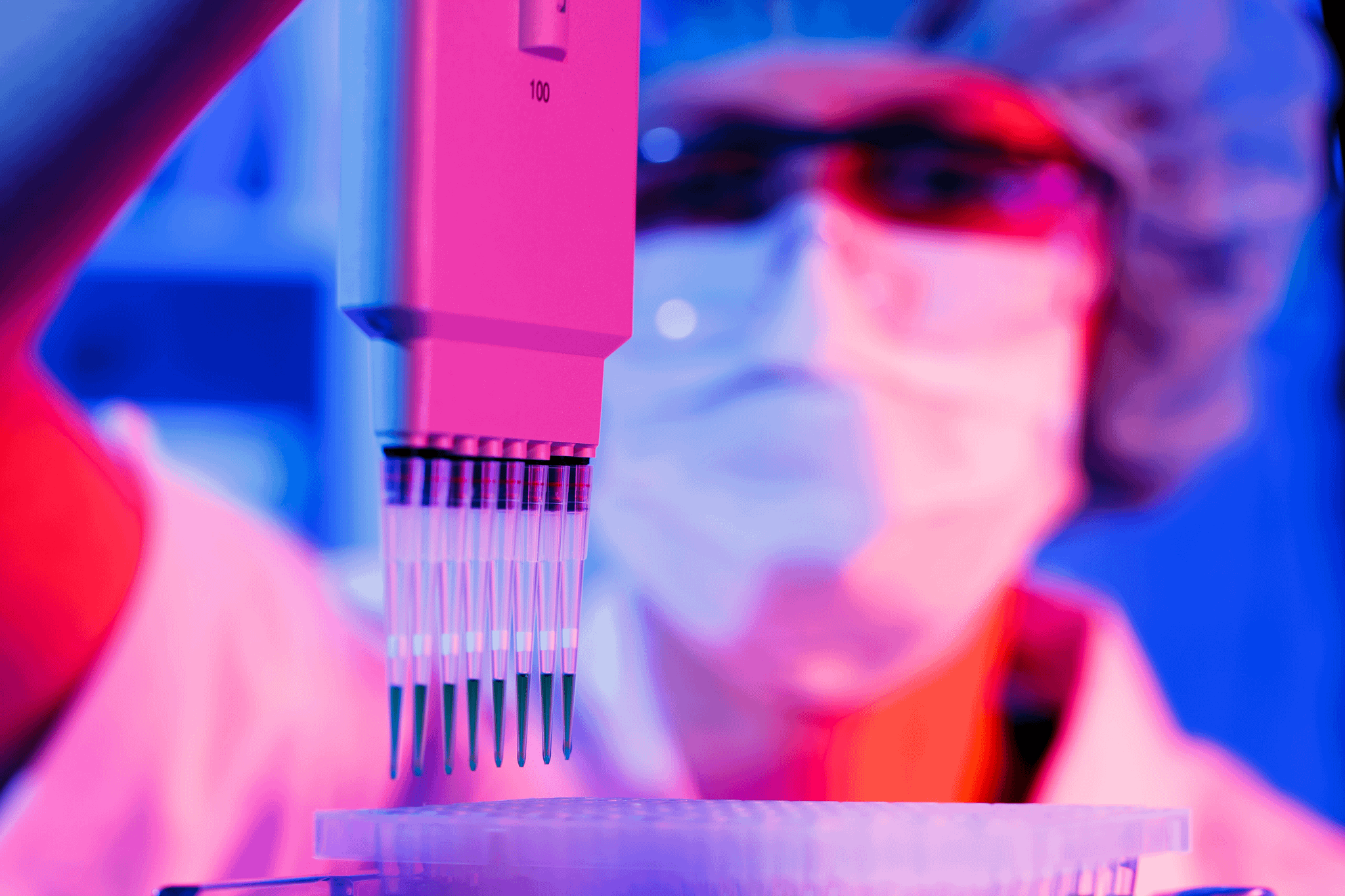 woman assistant in laboratory with multi pipette in the clinic, the research of cancer stem cells