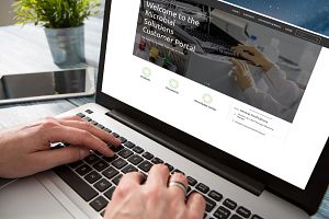 Scientist accessing the Celsis customer portal on a laptop