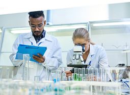 Two scientists working in a lab.
