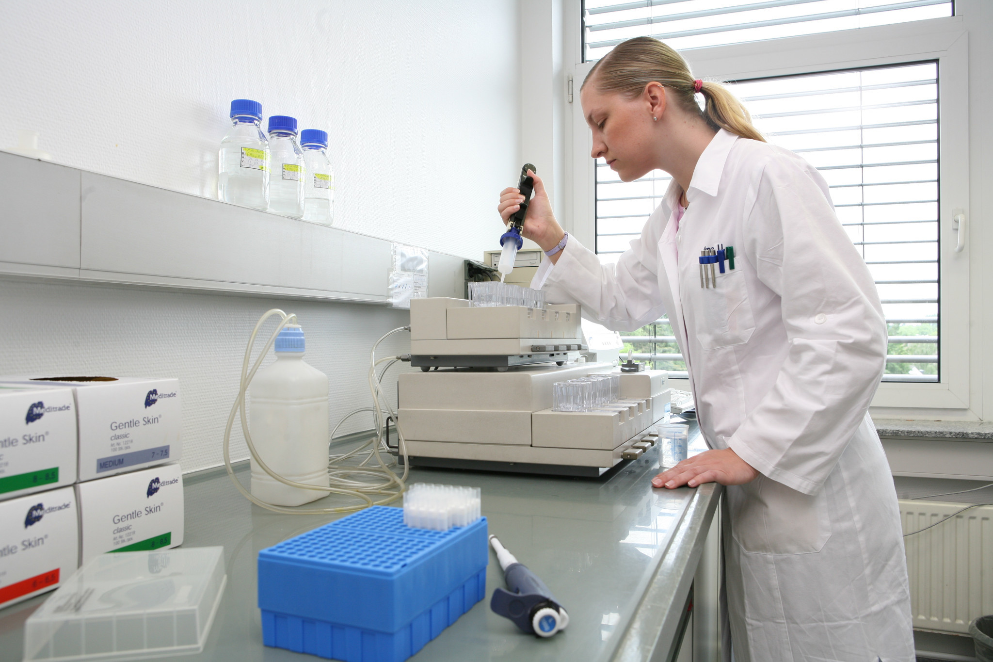 Laboratory technician performing biologics testing