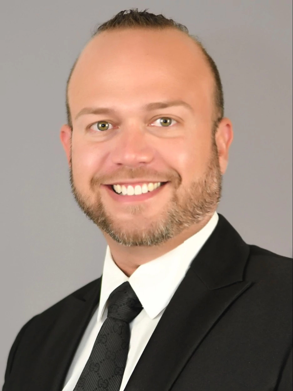 Headshot of Dr. Miguel Nogueras showing a smiling man with a beard