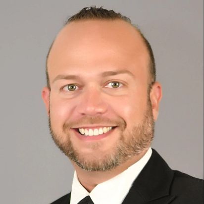Headshot of Dr. Miguel Nogueras showing a smiling man with a beard