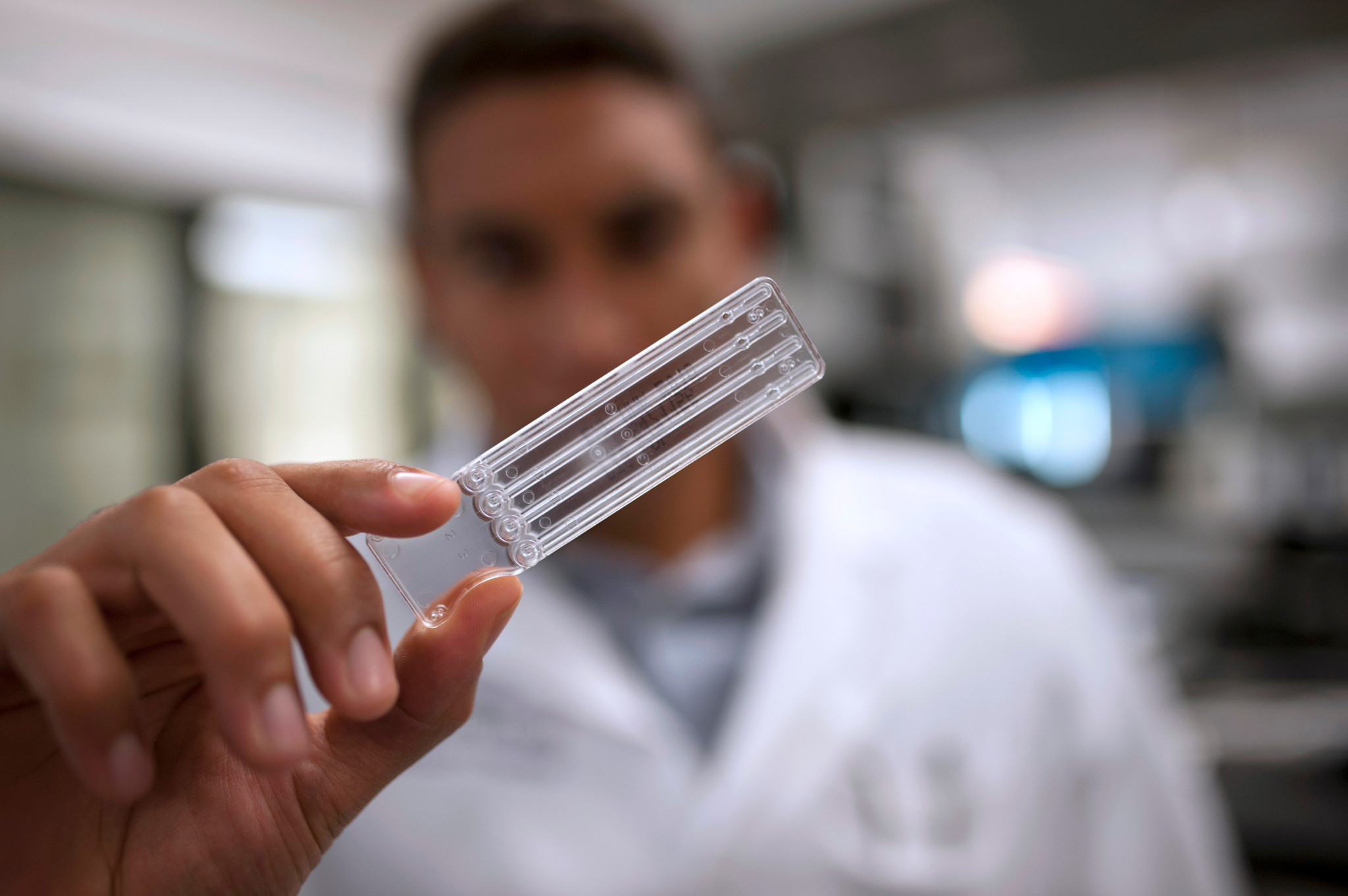 Scientist holding a cartridge