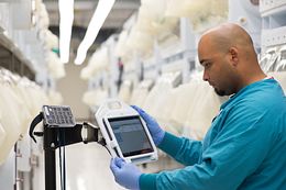 technician monitoring animal health in a vivarium