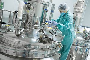 Pharmaceutical technician in sterile environment at Cell and Gene Therapy CDMO