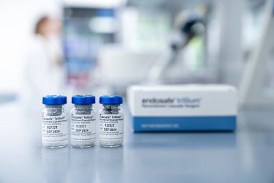 Image of three Endosafe Trillium vials in a row on a lab bench with the product box in the background.