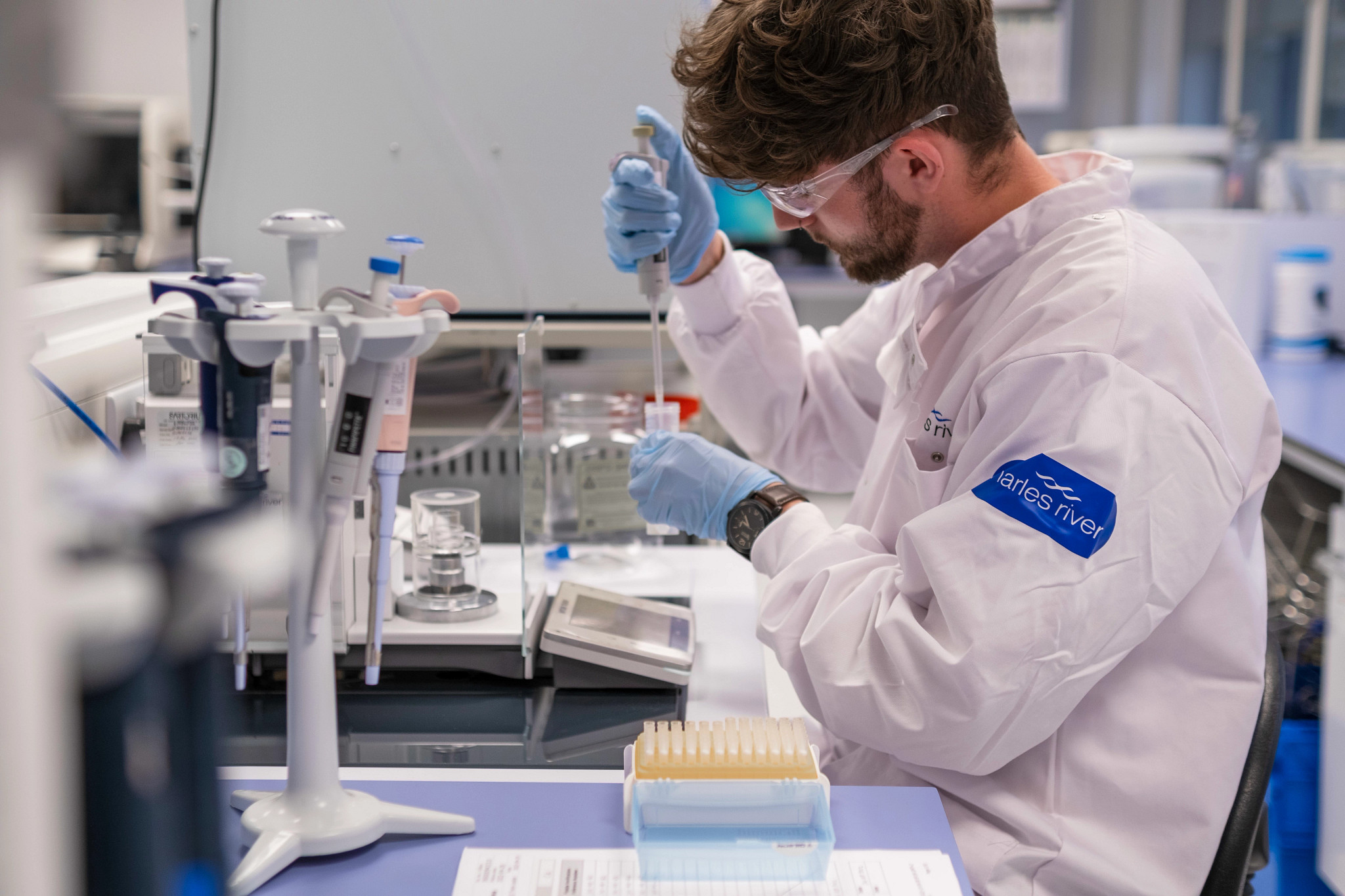 Scientists conducting experiment in a lab.