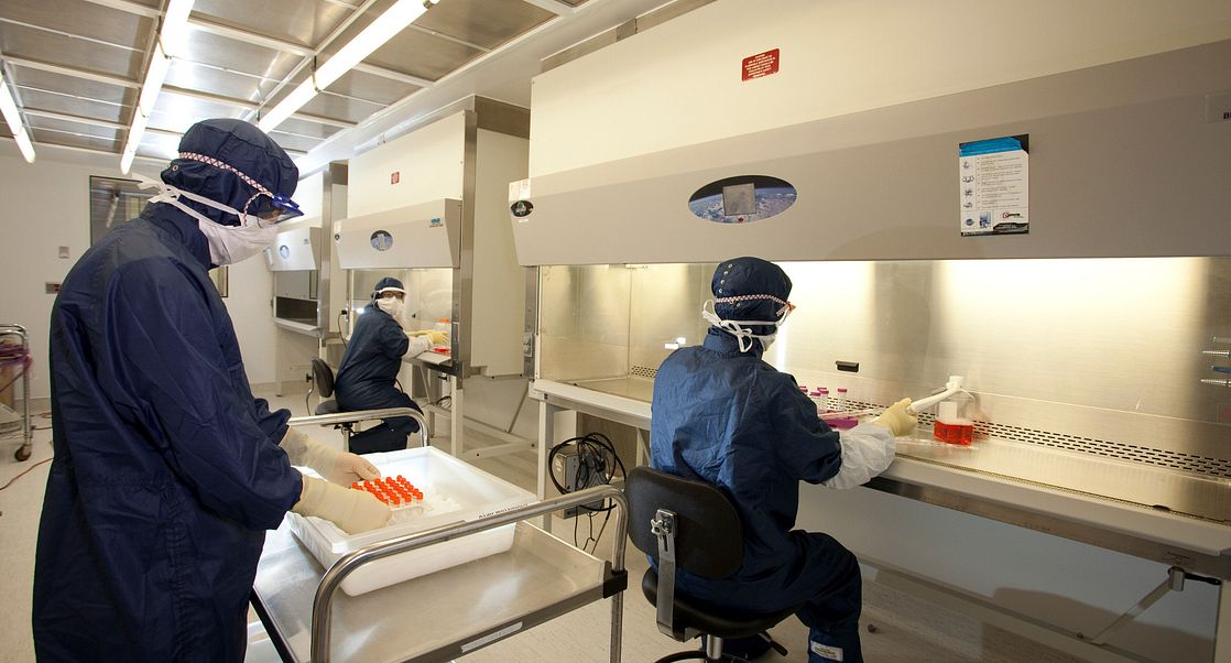 lab workers in a clean room facility