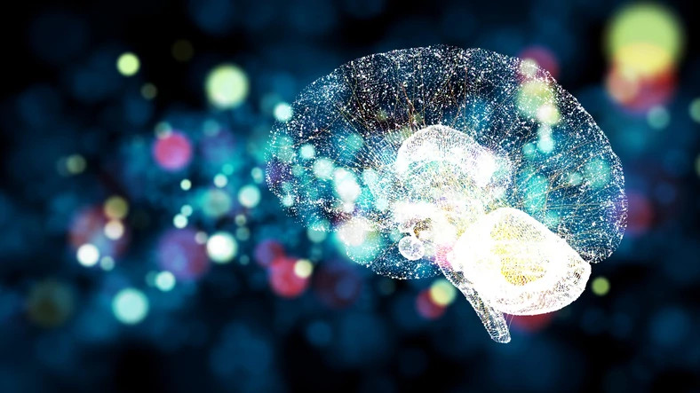 Graphic rendering of neurons in a brain over a background of orbs of light.