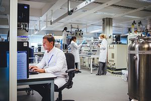 QC microbiologists in the laboratory using atp-bioluminescence for rapid sterility testing