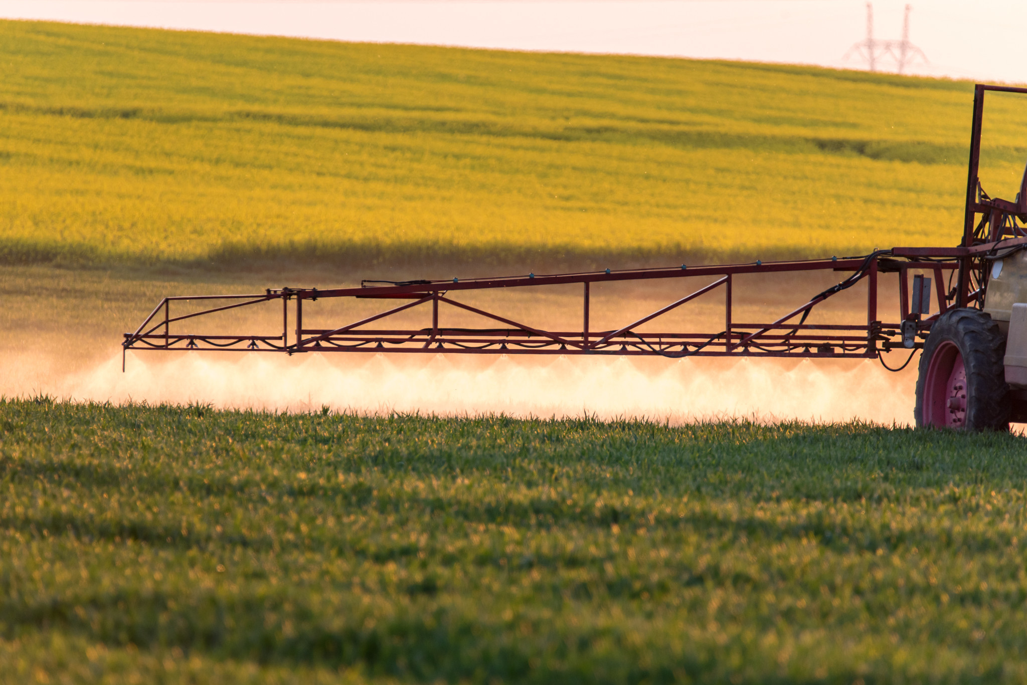Agrochemical product being applied to field of crops