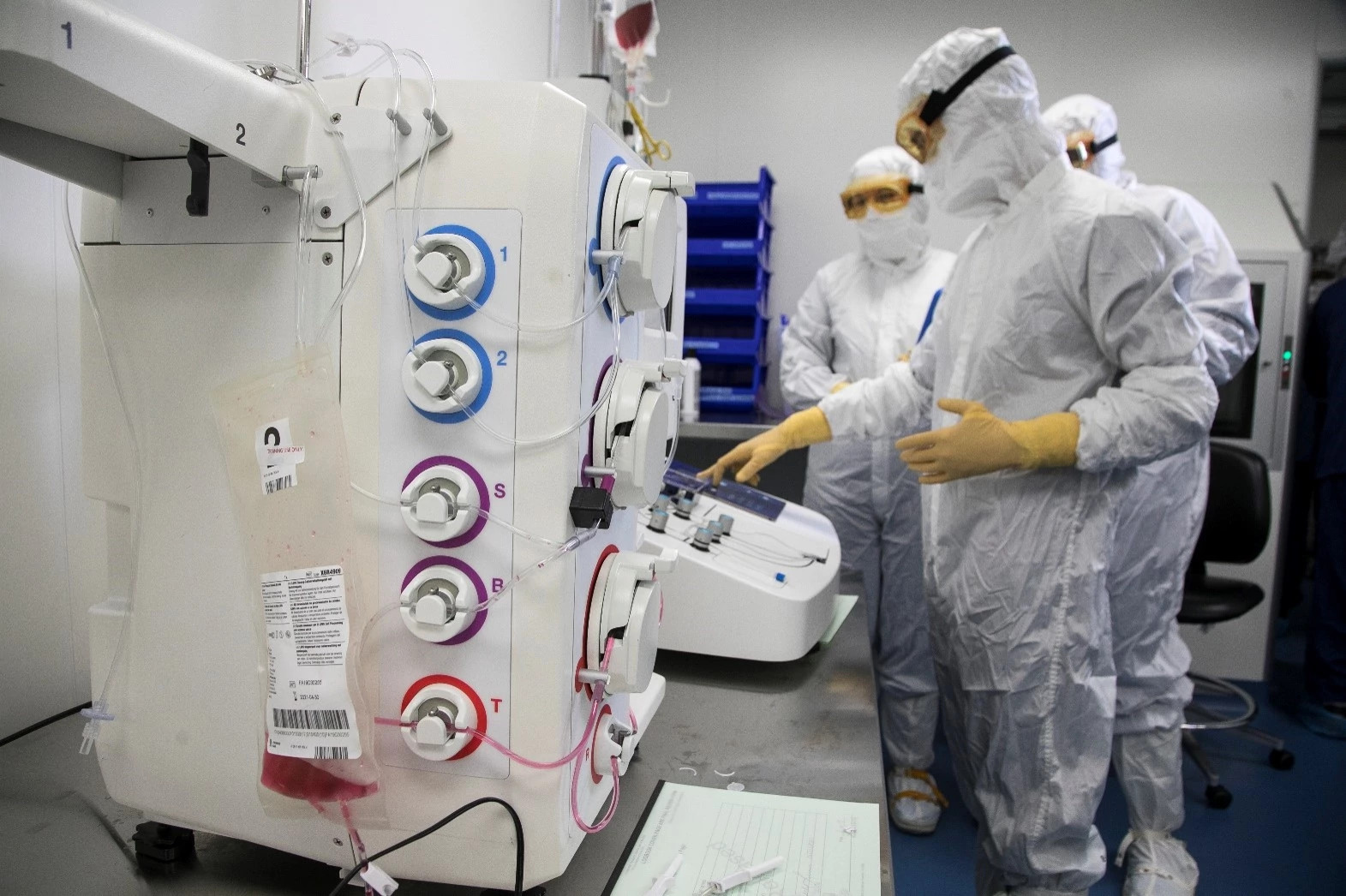 People working in a CDMO cleanroom.