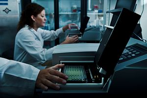 lab technician performing kinetic chromogenic LAL test using BioTek® incubating microplate reader