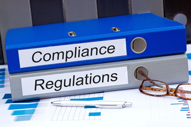 a set of binders with Microbiology Quality Regulatory Guidance guidelines