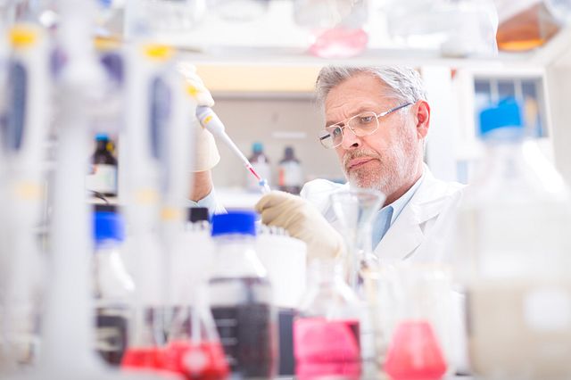 Life scientist researching in laboratory.