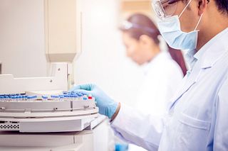 Scientists experimenting in laboratory